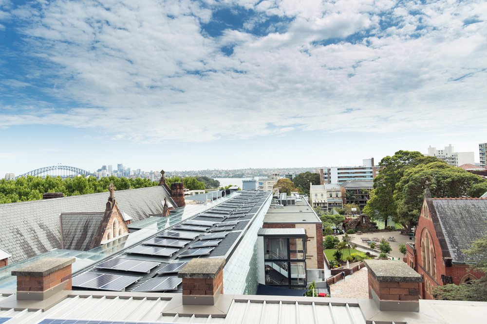 Expansive College Rooftop Views of City Skyline with Harbour Bridge