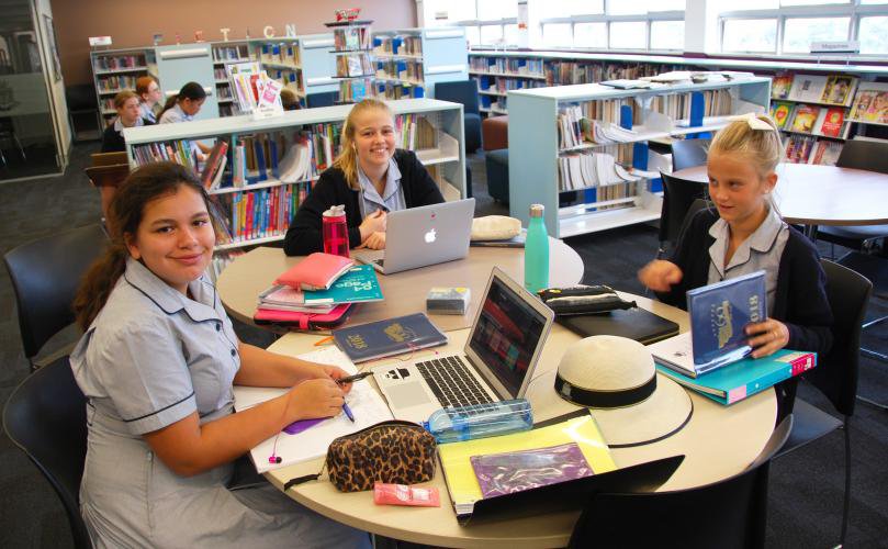 Students Smile for the Camera at the Learning Resource Centre