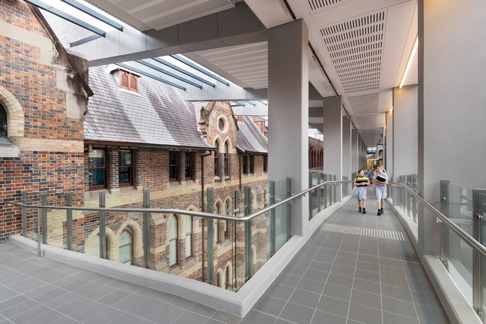 Two Students Walking Through Mark 2:22 Atrium