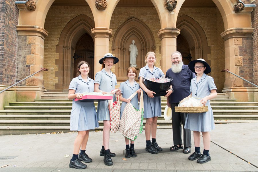 Boarder Students with Trays of Goodies Pose for the Camera Outside the Chapel